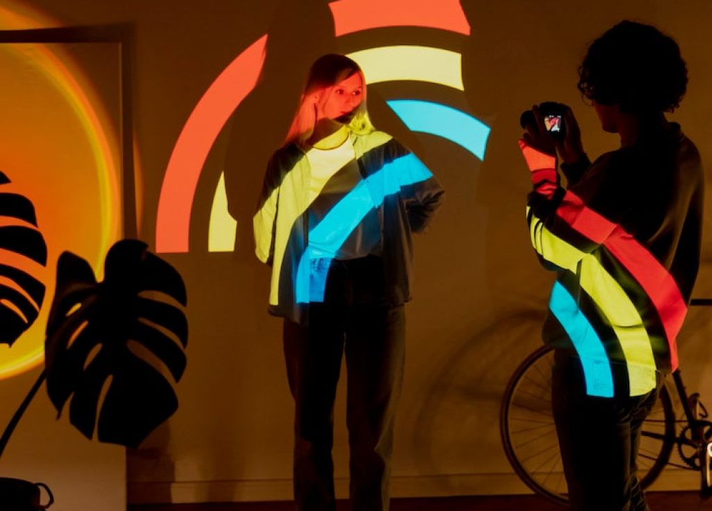 couple-taking-photos-light-movie-projector_23-2149377353