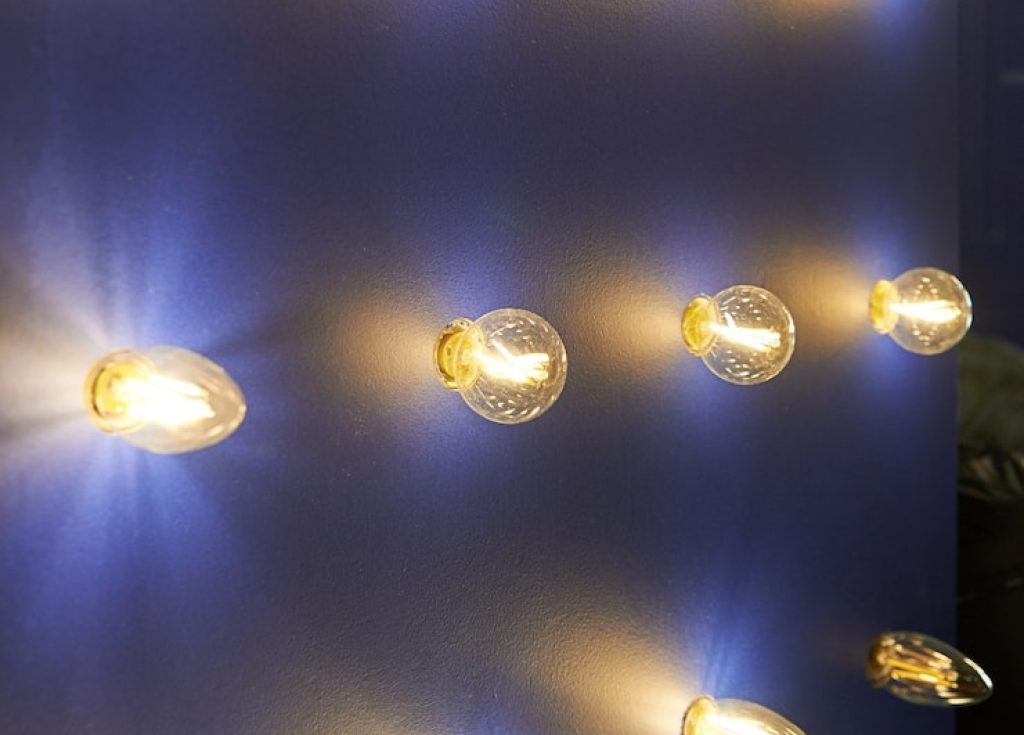 lamps-different-sizes-shapes-booth-showcase-led-lamps-lamp-sticking-out-wall_101266-5281